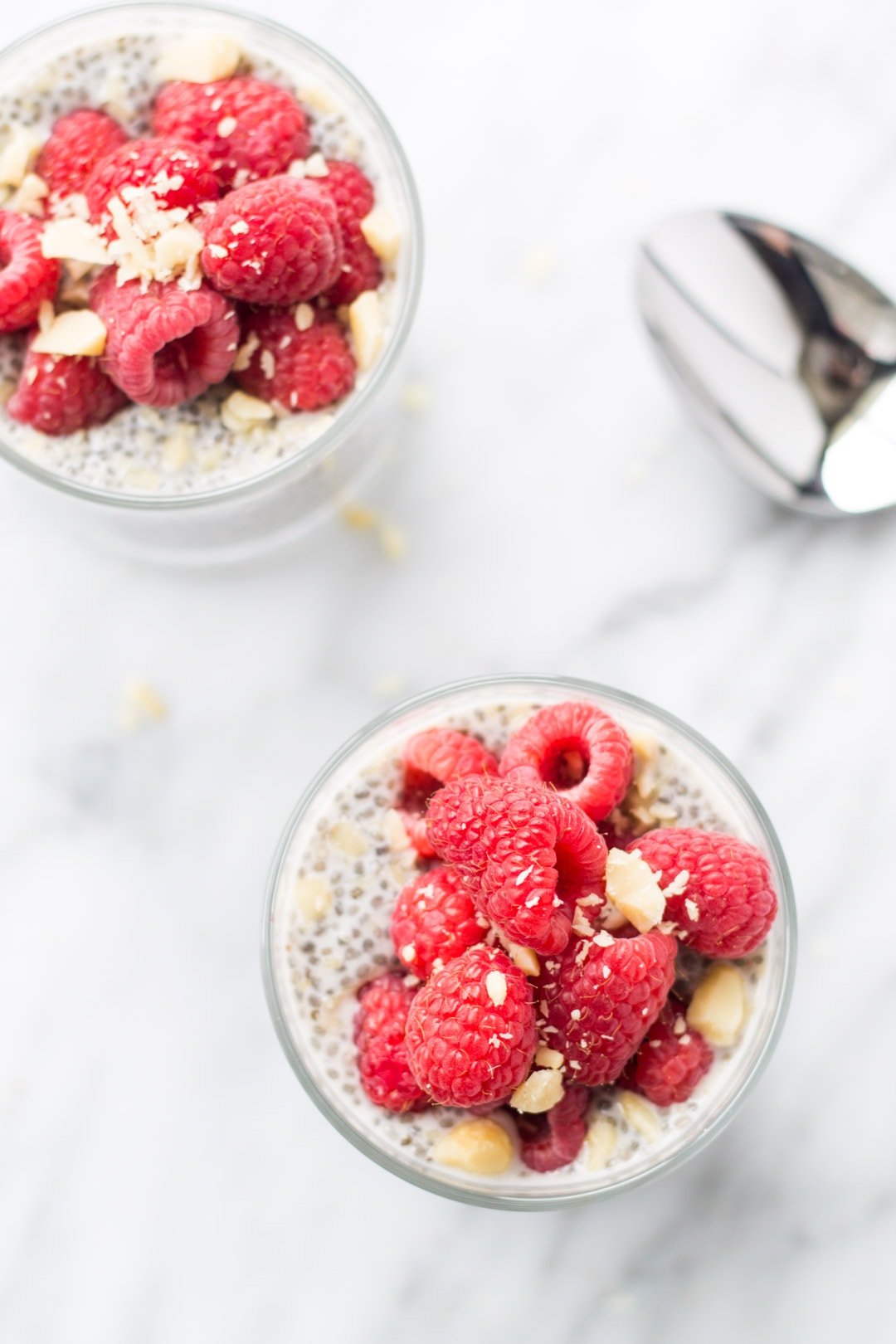 Two bowls filled with low FODMAP raspberry vanilla chia pudding