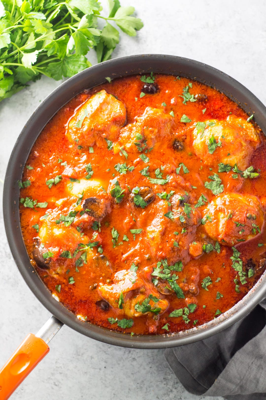 Looking down at a skillet filled with low FODMAP chicken cacciatore