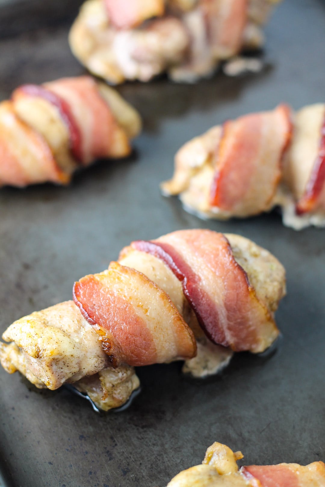 Pan of low FODMAP bacon wrapped chicken
