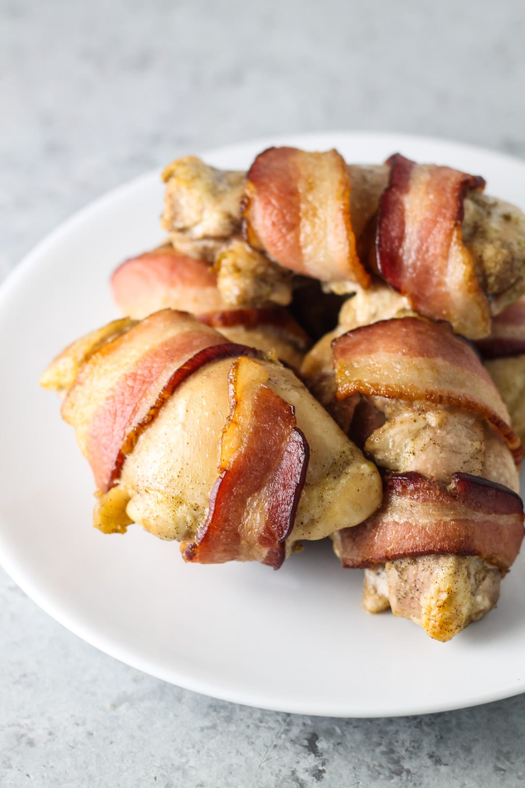 Plate of low FODMAP bacon wrapped chicken