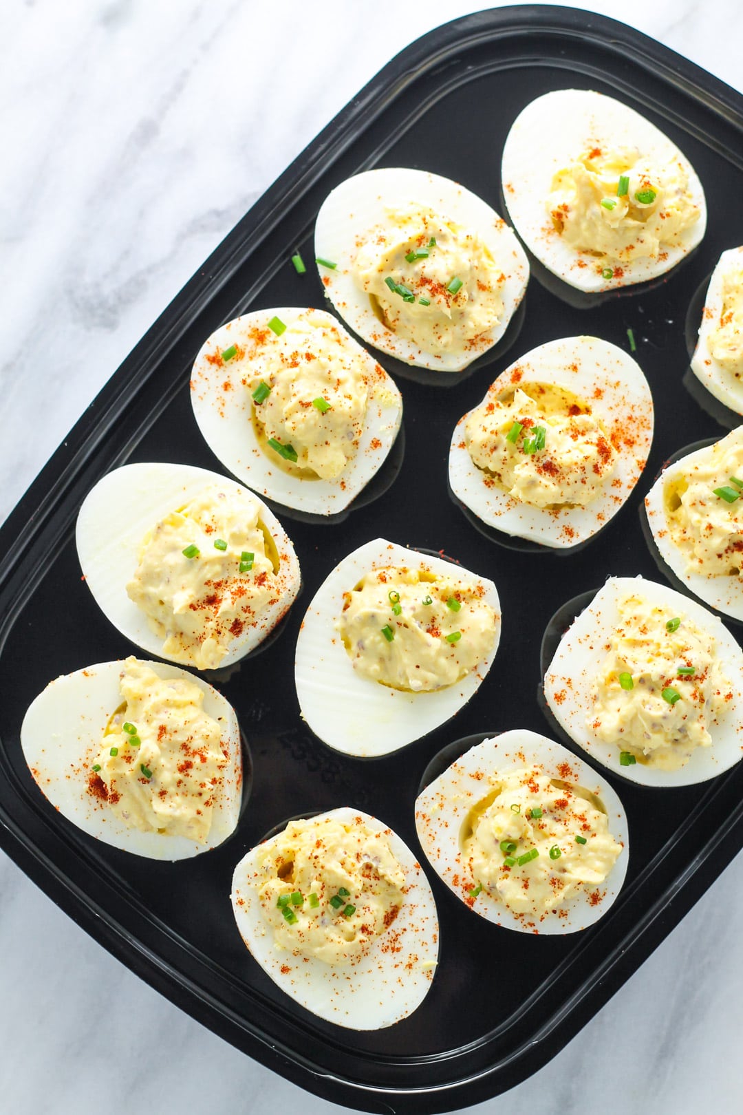 Low FODMAP deviled eggs on a black tray