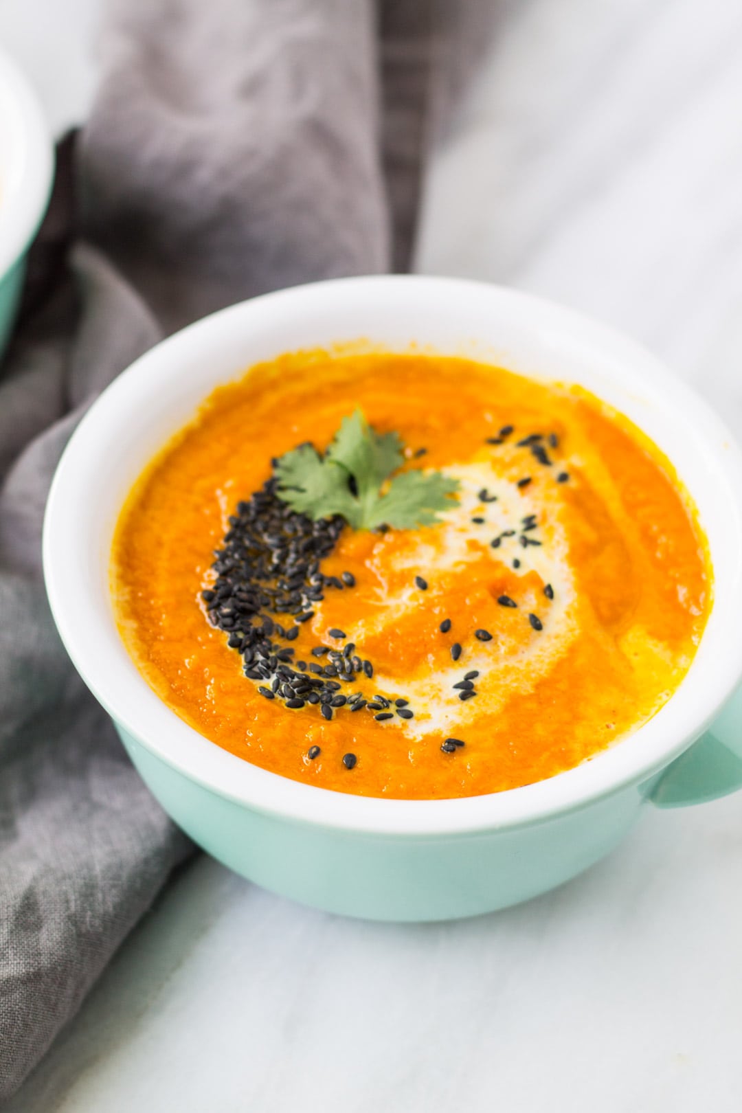 Bowl of low FODMAP carrot and tomato soup