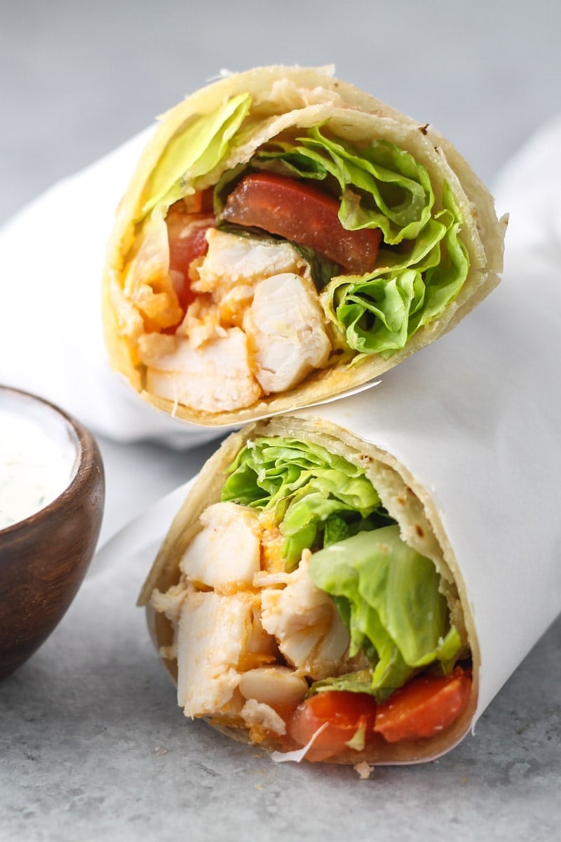 Two buffalo chicken wrap halves stacked on top of one another.