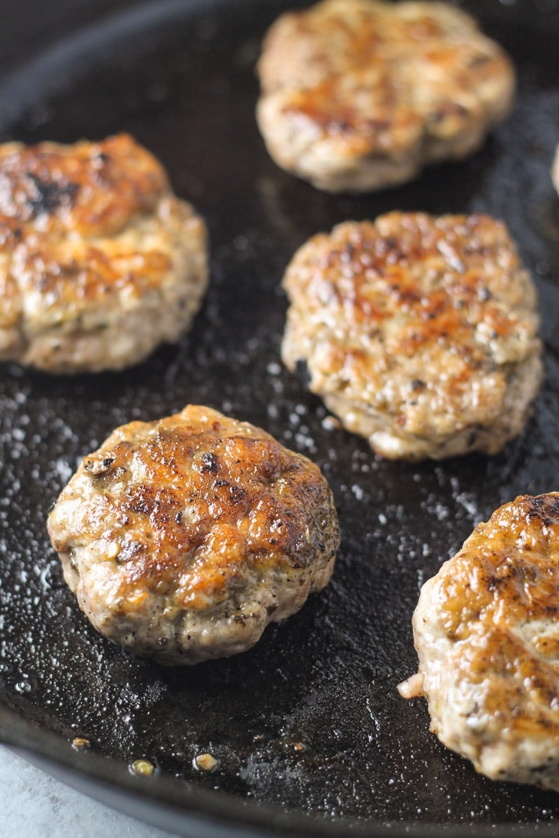 A just-cooked breakfast sausage patties in a skillet