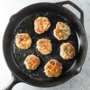 A cast-iron skillet filled with low FODMAP breakfast sausage patties