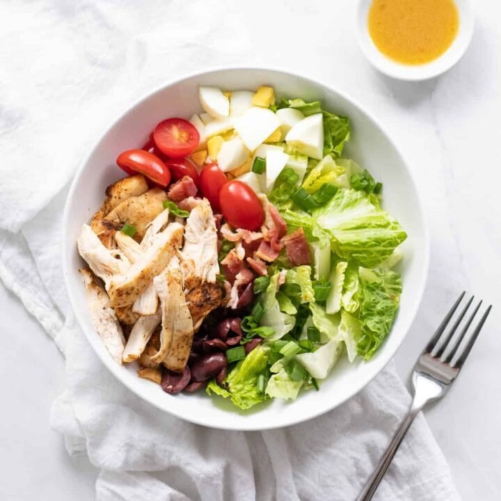 Cobb salad in a shallow white bowl.