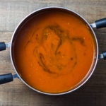 Overhead shot of a saucepan filled with low FODMAP tomato soup