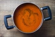 Overhead shot of a saucepan filled with low FODMAP tomato soup