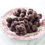 Plate of low FODMAP dark chocolate blueberry mac nut bites