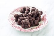 Plate of low FODMAP dark chocolate blueberry mac nut bites