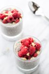 Two cups filled with low FODMAP raspberry vanilla chia pudding