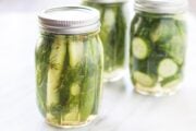 Close up shot of three jars filled with low FODMAP refrigerator dill pickles