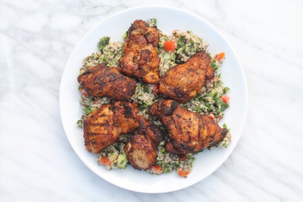 A white plate filled with low FODMAP tabbouleh and Moroccan chicken