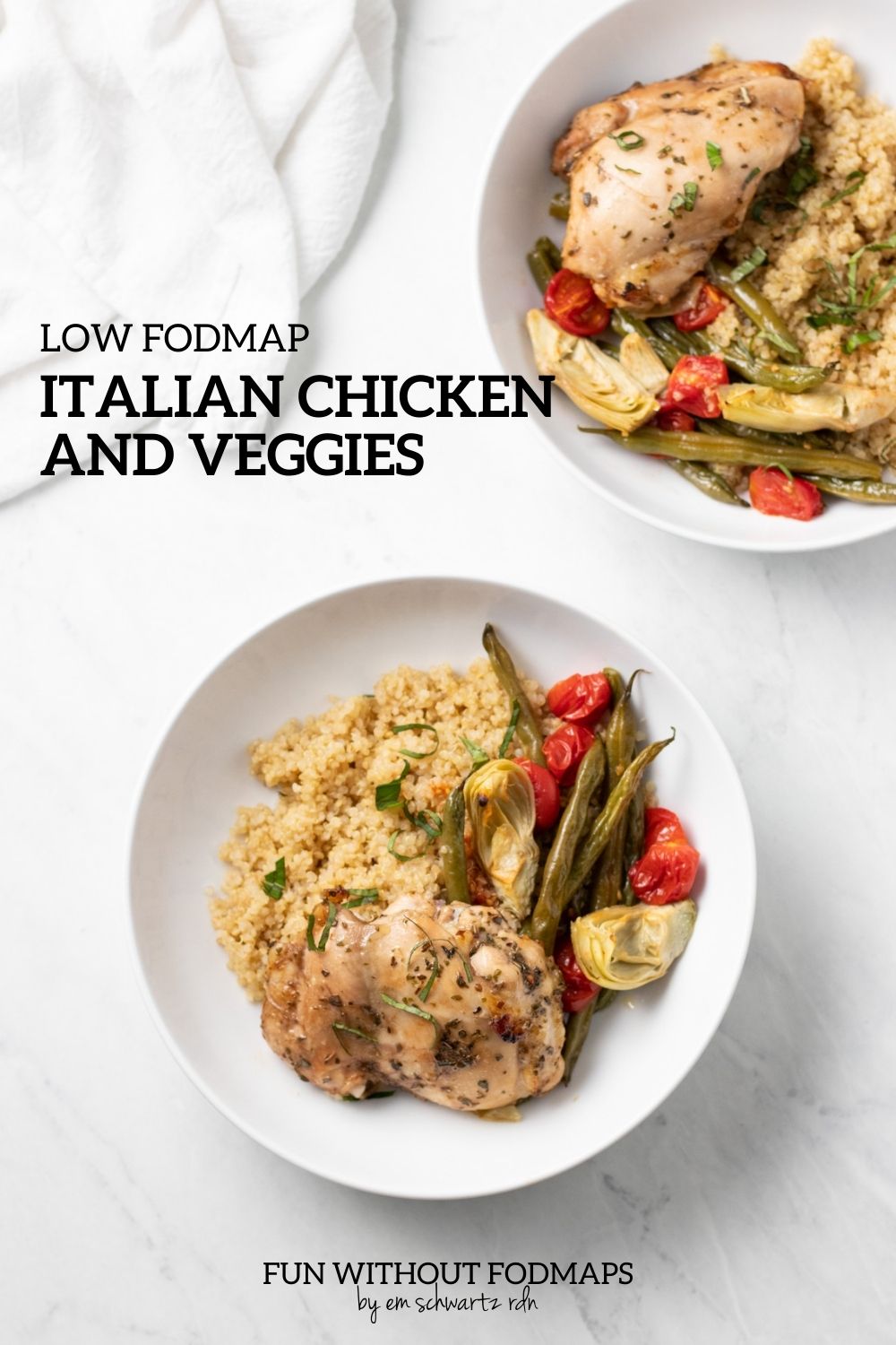 Two bowls with baked chicken, green beans, cherry tomatoes, and canned artichokes over cooked quinoa sit on a white marble counter. In the white space, black text reads "Low FODMAP Italian Chicken and Veggies"