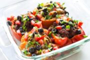 Low FODMAP Taco Stuffed Peppers make an easy meal. This supper recipe is full of spices and fresh flavor. Gluten free and easily modified to dairy free, whole30 and paleo friendly.