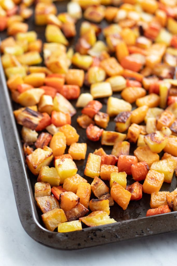 A sheet pan filled with low FODMAP roasted root veggies