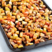 A pan of low FODMAP roasted root veggies - parsnips, carrots, rutabaga, and potatoes