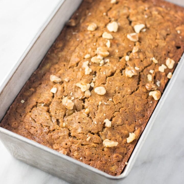 A square image of a bread loaf pan filled with low FODMAP banana bread