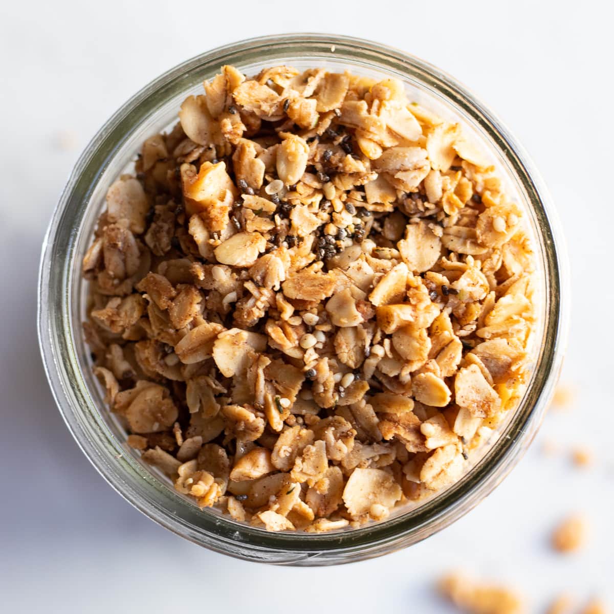 A close up of low FODMAP granola made with oats, walnuts, and optional chia seeds.