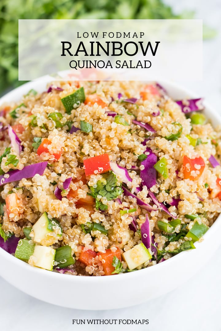 A close up of low FODMAP Rainbow Quinoa Salad. There is a white rectangle overlay with dark gray text that reads low FODMAP rainbow quinoa salad at the top of the image. Centered at the bottom it says FUN WITHOUT FODMAPS.