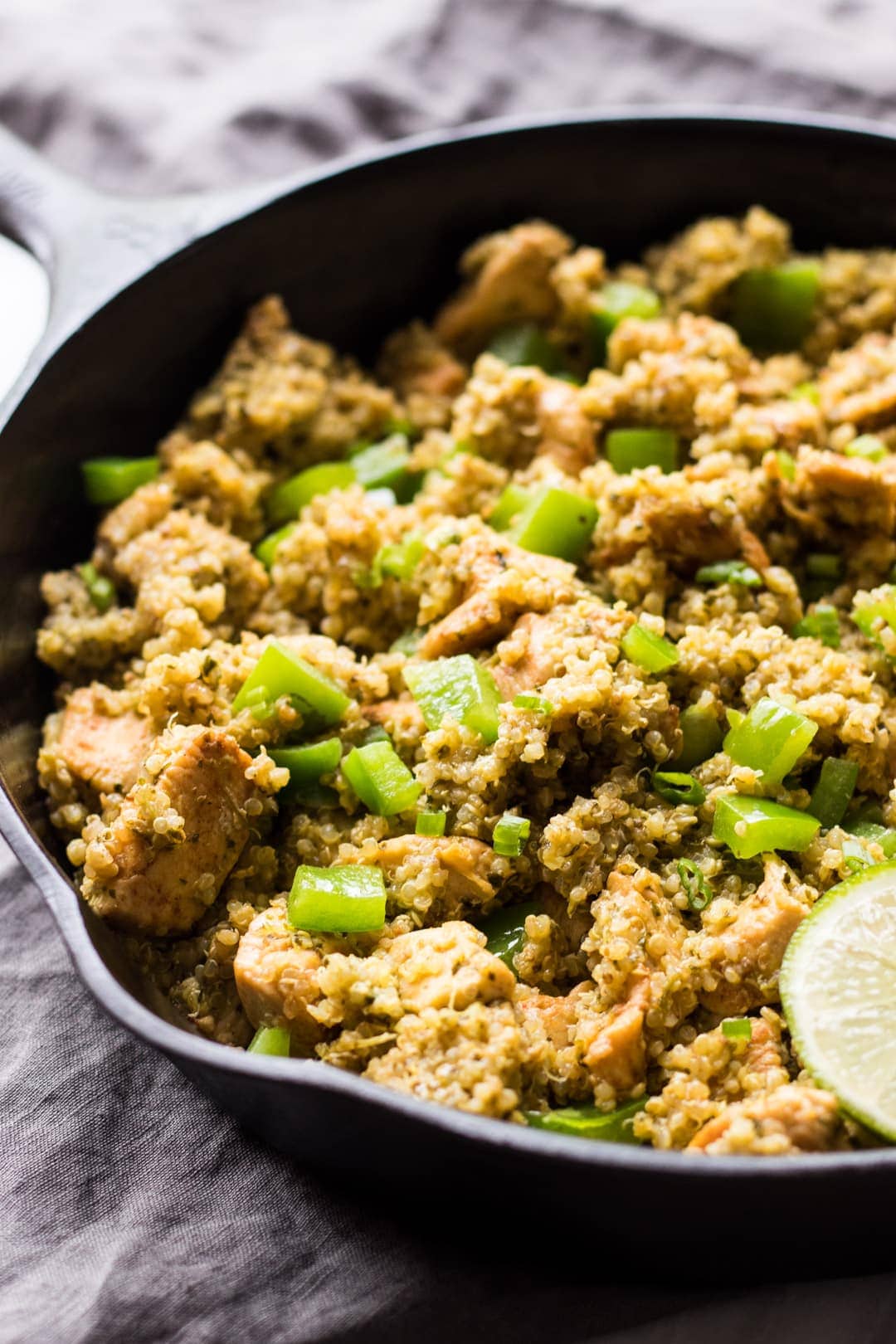 Close up of Low FODMAP Cilantro Lime Quinoa with Chicken in a cast-iron skillet.