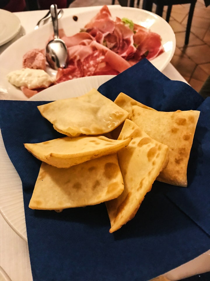 Emilian fried bread and local parma ham at La Capriata in Bologna Italy