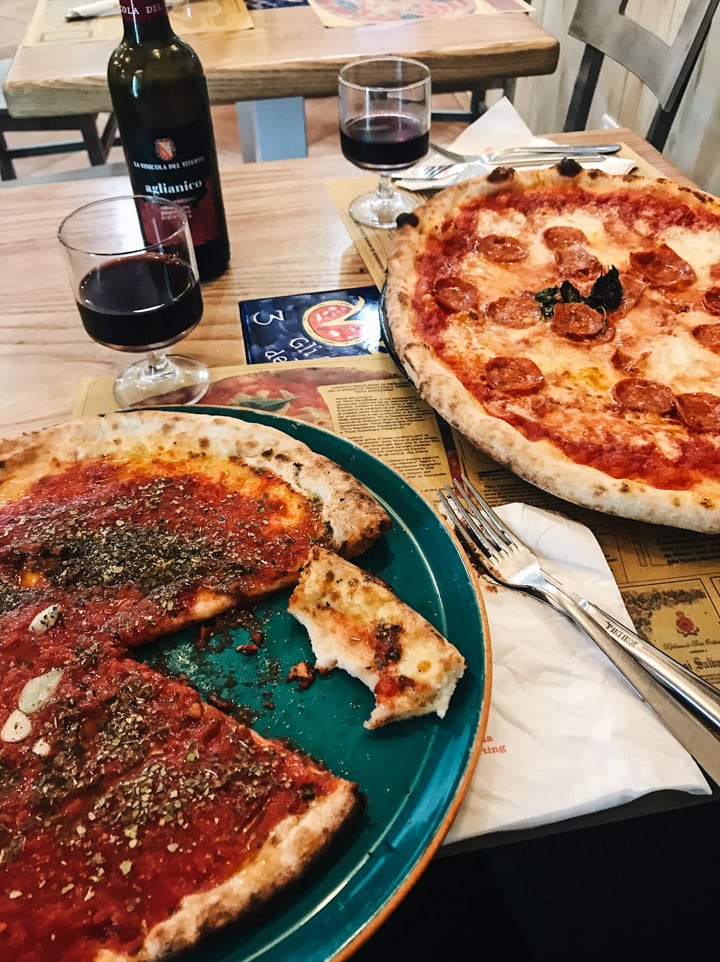 Two pizzas at Pizzeria Vesi San Biagio in Naples Italy