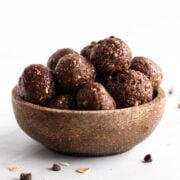 A coconut shell bowl filled with low FODMAP peanut butter brownie bites