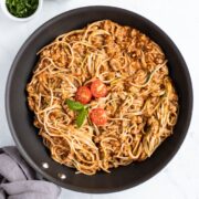 A skillet filled with low FODMAP spaghetti and zoodles.