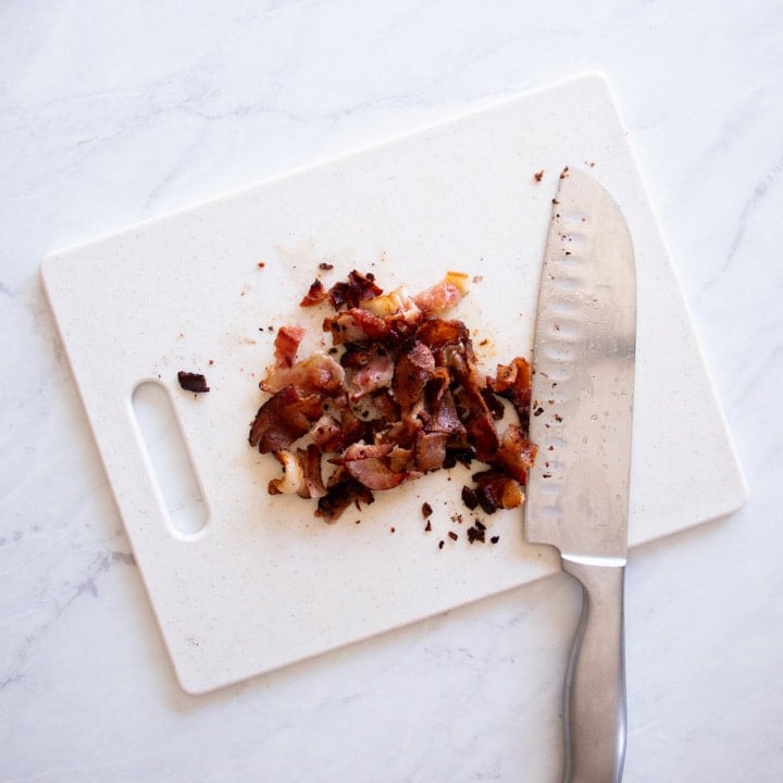 Diced bacon on a cutting board.