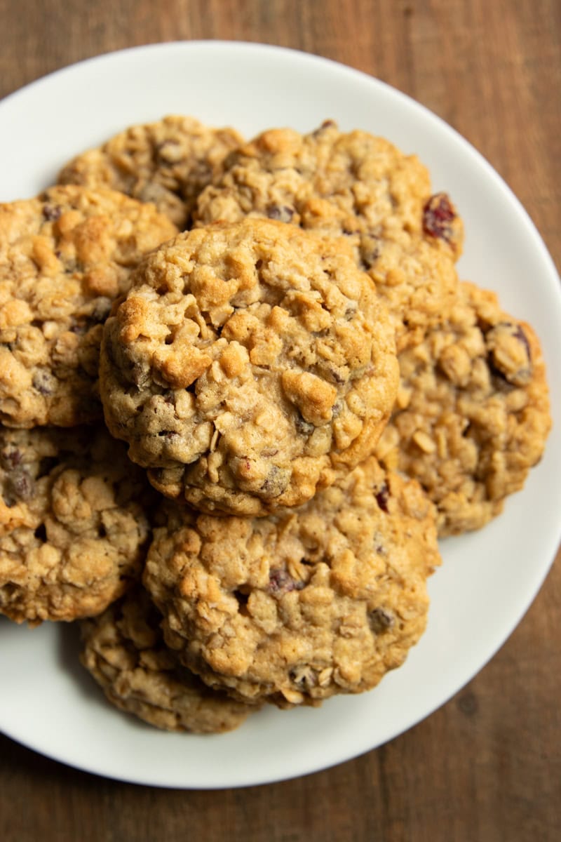 A smooth white plate filled with low FODMAP trail mix cookies.