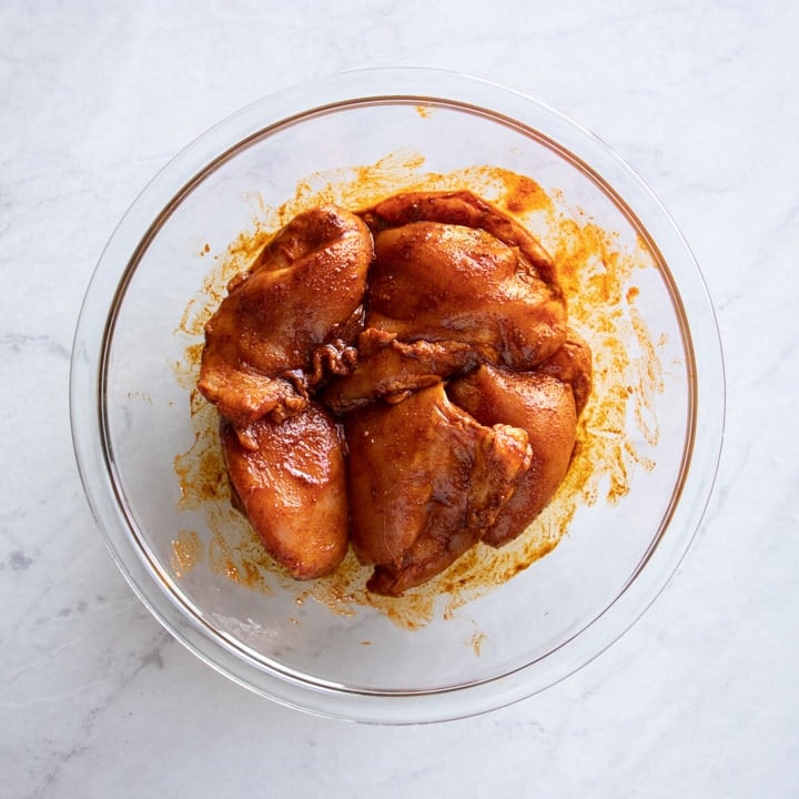 Chicken thighs coated in low FODMAP Moroccan chicken marinade 