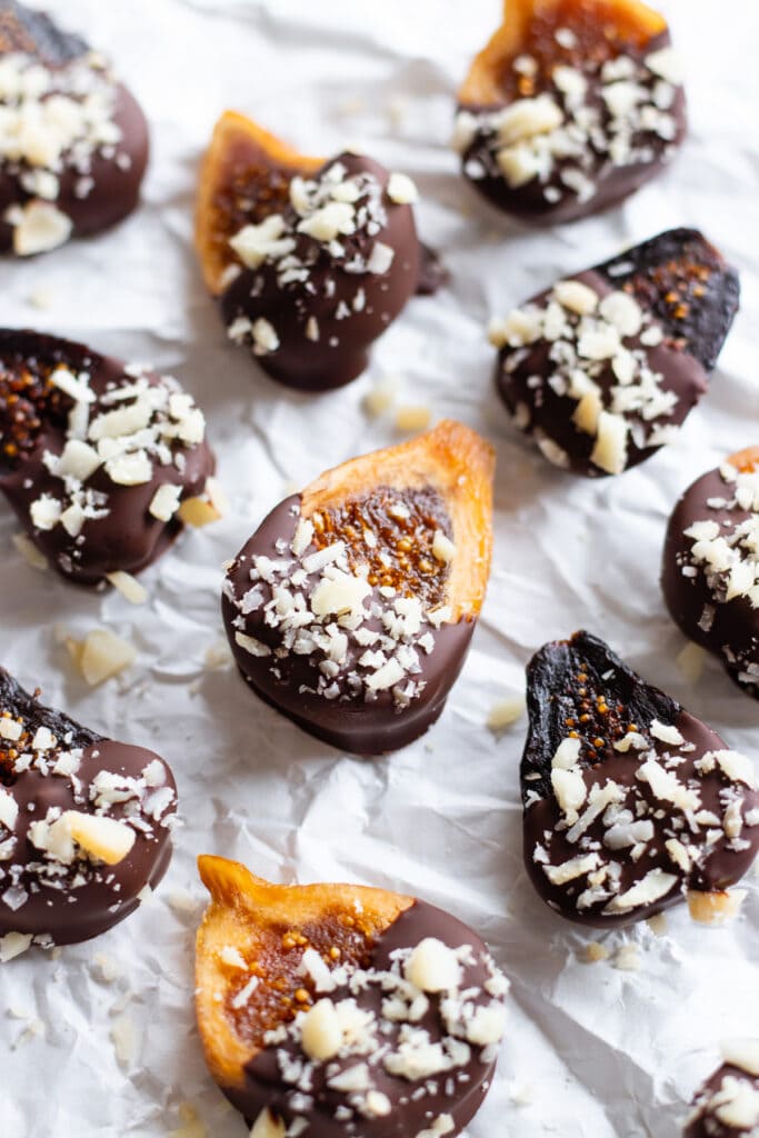 chocolate covered dried figs with chopped macadamia nuts