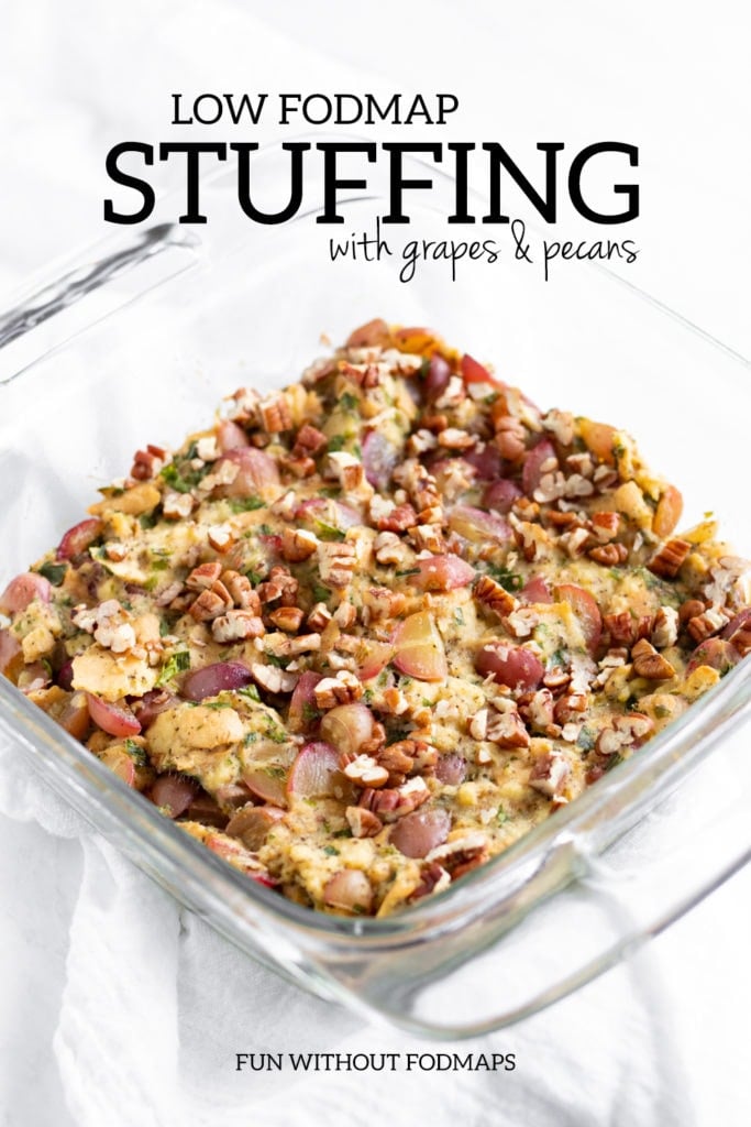 A pan of stuffing. In the white space above, black text reads "Low FODMAP Stuffing with Grapes and Pecans."