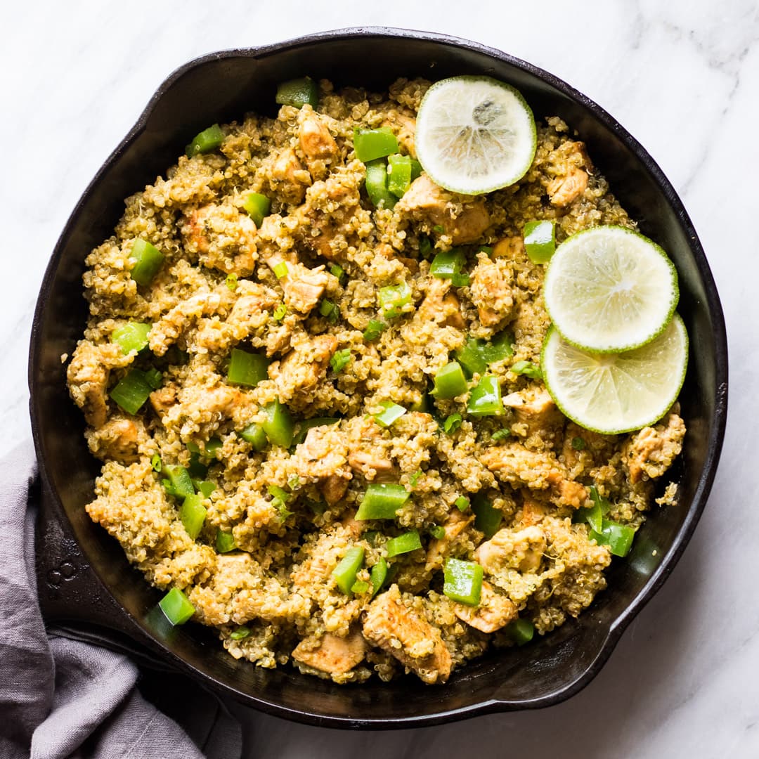 A cast-iron skillet filled with low FODMAP cilantro lime quinoa and chicken.