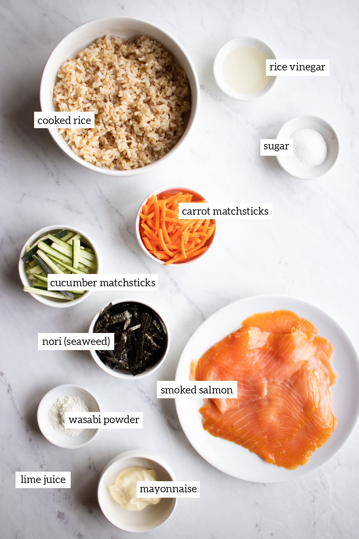 Ingredients for these low FODMAP sushi bowls are measured out into individual white dishes