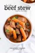 Looking down at a bowl of beef stew topped with fresh parsley. The bowl sits on a white marble background and in the white space above the bowl, black text reads "Low FODMAP Beef Stew - Instant Pot | Slow Cooker."