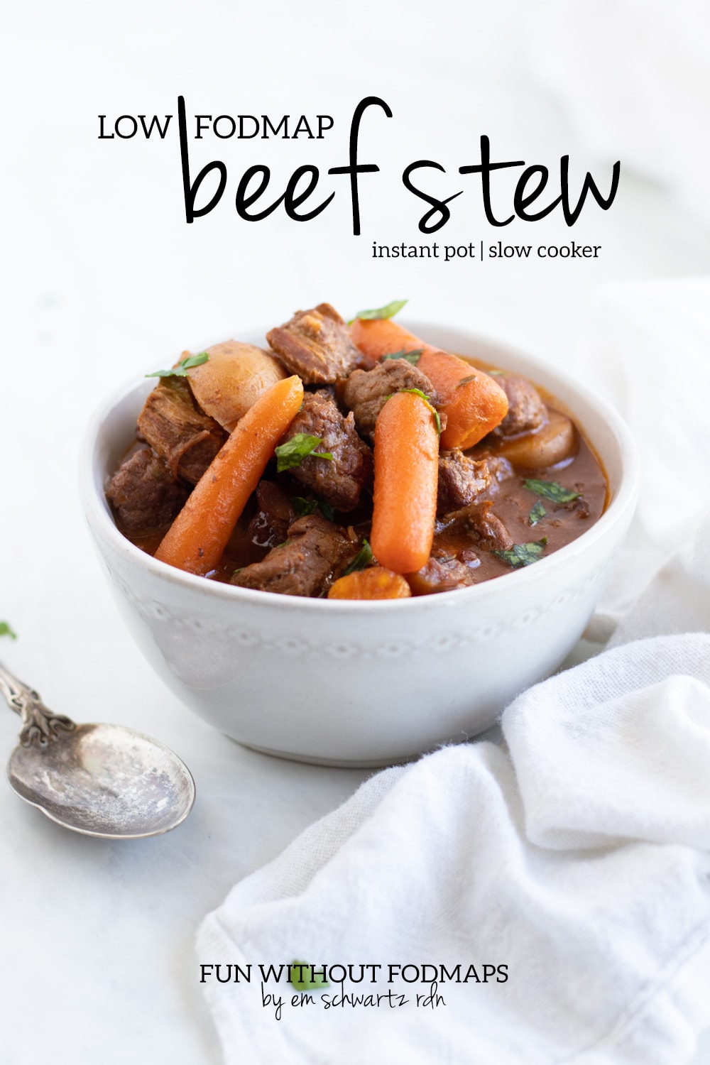 A bowl of beef stew sitting on a white marble counter. In the white space above, black text reads "Low FODMAP Beef Stew - Instant Pot | Slow Cooker."