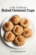 Looking down at a plate of pecan-topped oatmeal muffins. In the white space above black text reads "Low FODMAP Baked Oatmeal Cups"