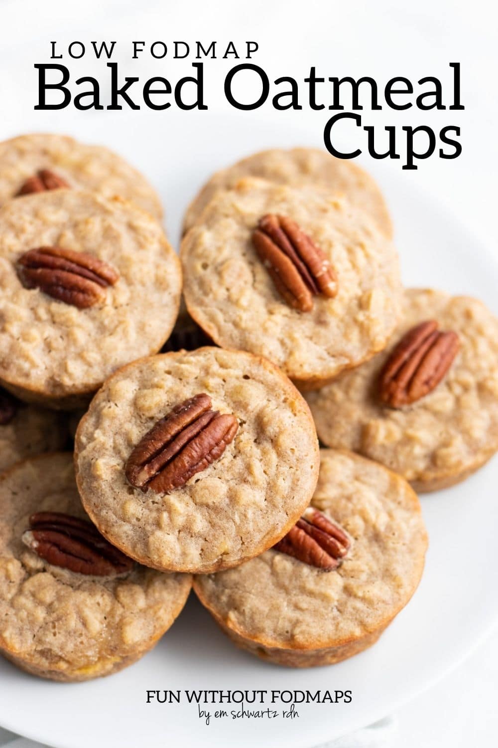 A plate of stacked baked oatmeal cups. Each has a pecan halve baked into the top. In the white space above the plate, black text reads "Low FODMAP Baked Oatmeal Cups."