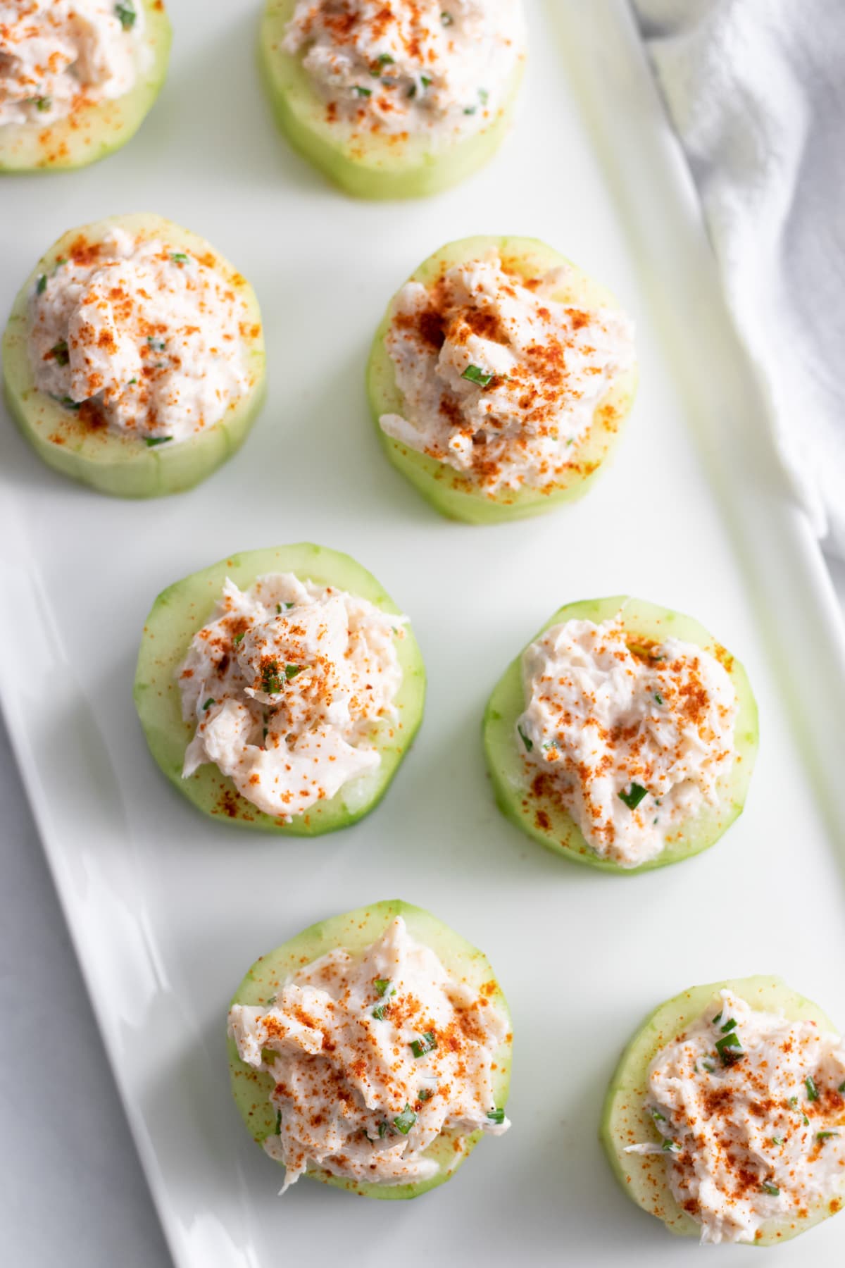 Cucumber cups filled with a creamy crabmeat mixture and dusted with paprika.
