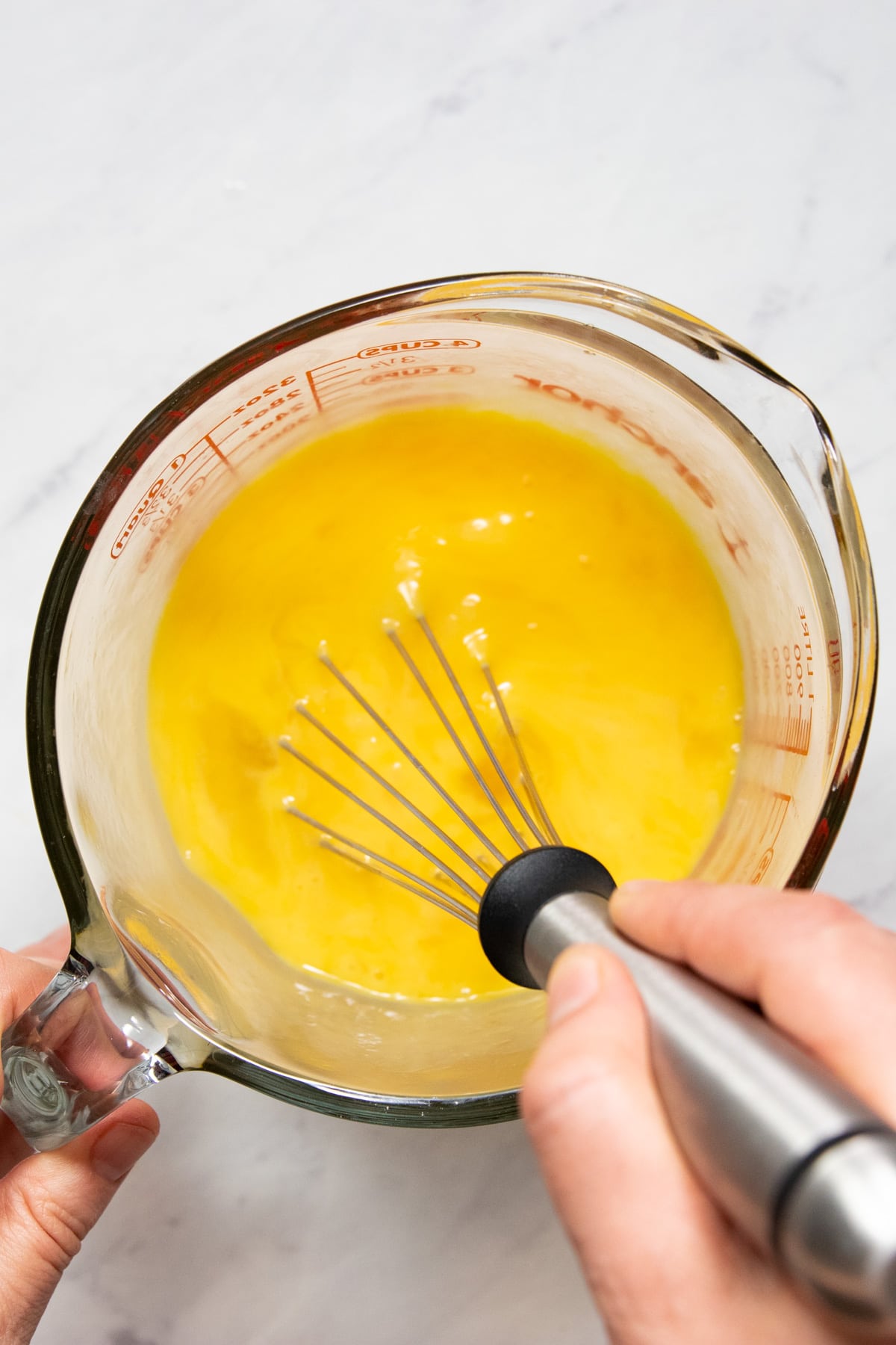 Whisking eggs in a quart-sized glass measuring cup
