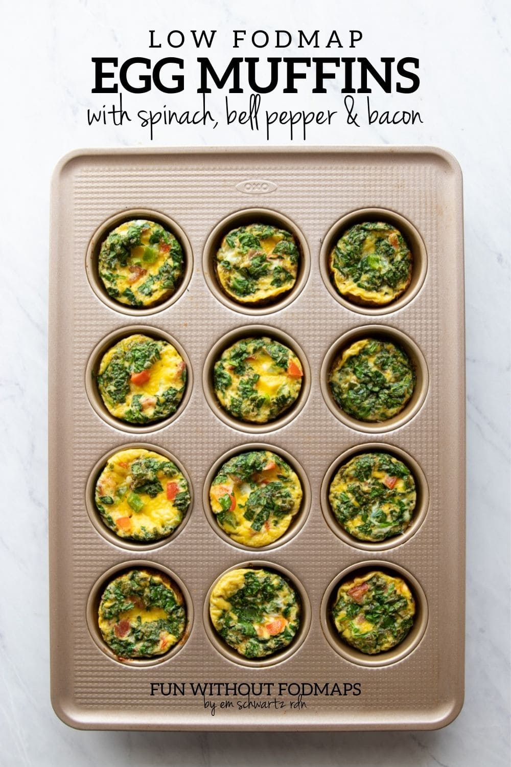 A muffin tin filled with veggie-filled egg muffins. In the white space above, black text reads "Low fODMAP Egg Muffins with Spinach, Bell Peppers & Bacon."