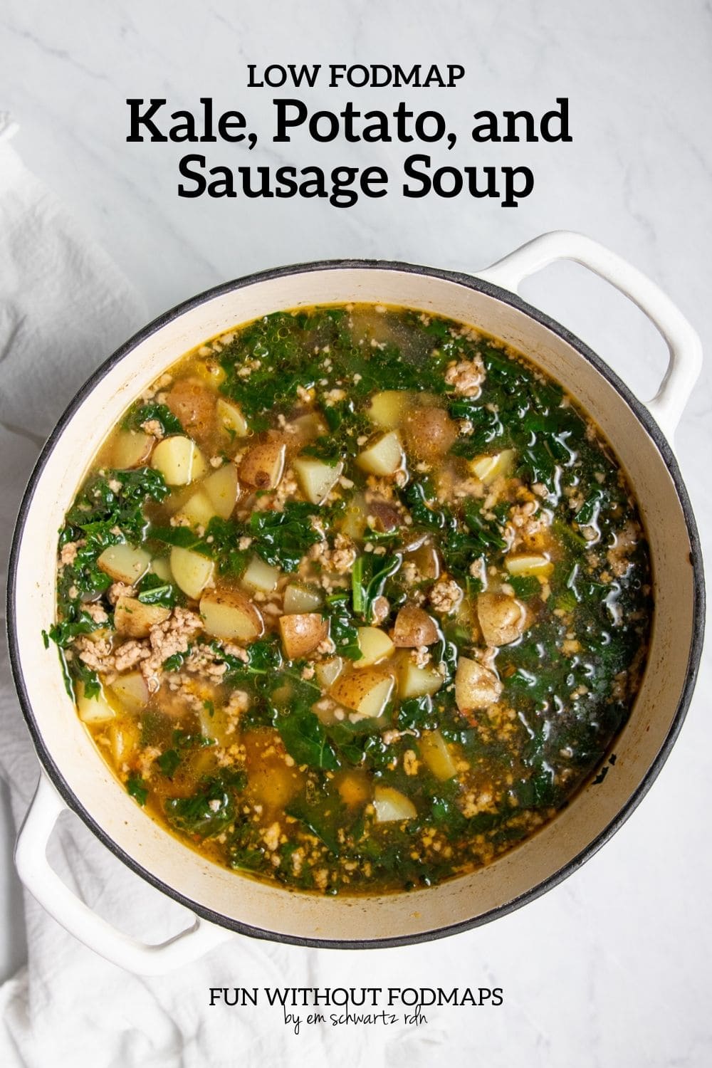 A Dutch oven filled with soup. In the white space above, black text reads "Low FODMAP Kale, Potato, and Sausage Soup."