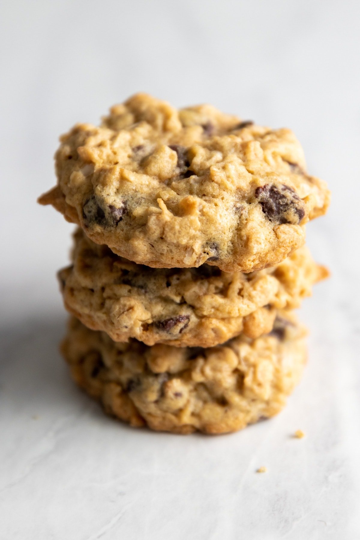 A stack of three low FODMAP oatmeal chocolate chip cookies.