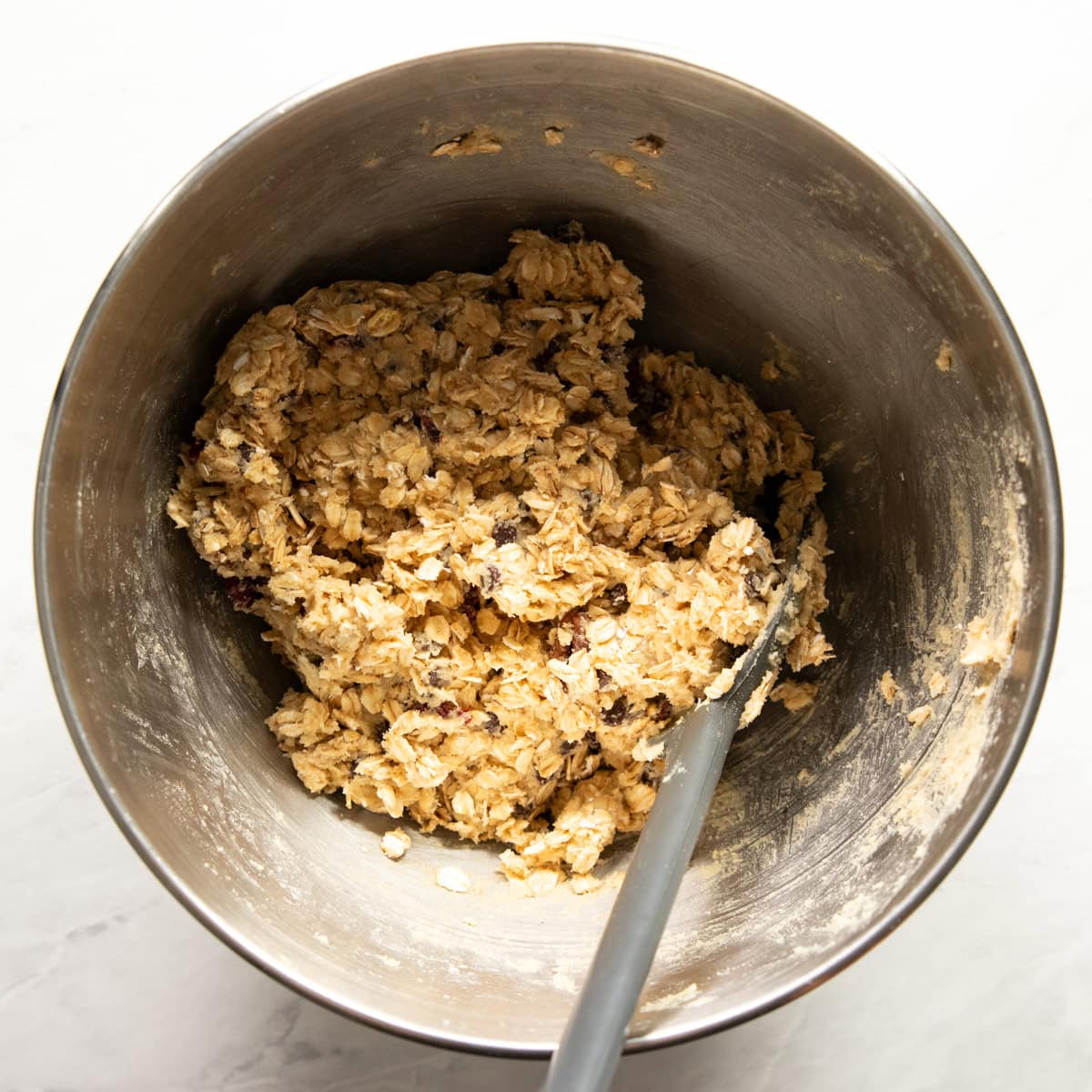 Stand mixer bowl filled with trail mix cookie dough.