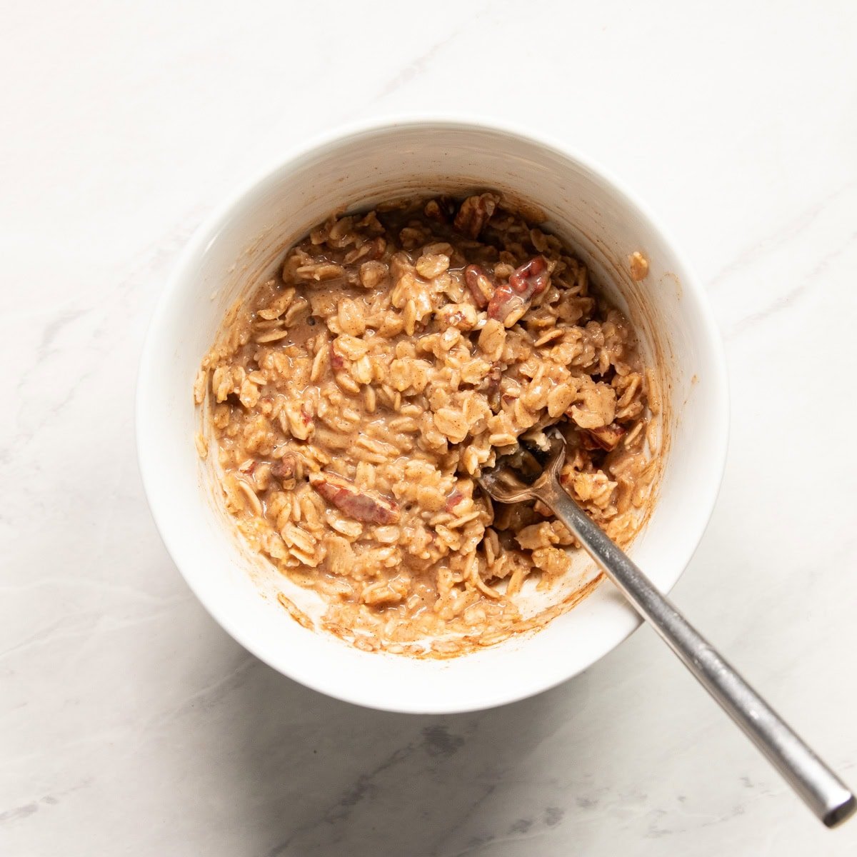 A bowl of prepared oatmeal made with almond milk.