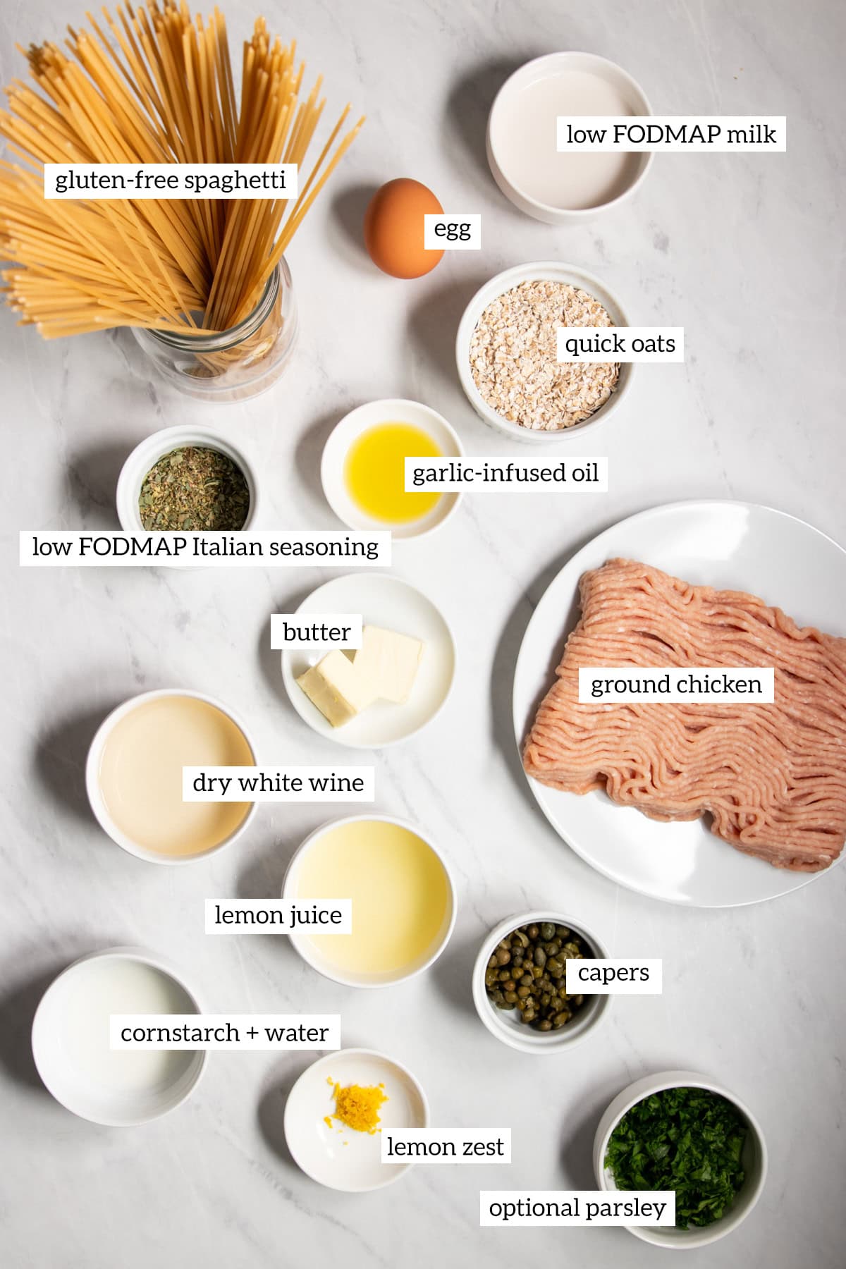 Ingredients needed for chicken piccata meatballs with gluten-free spaghetti are prepared and measured out into individual containers.