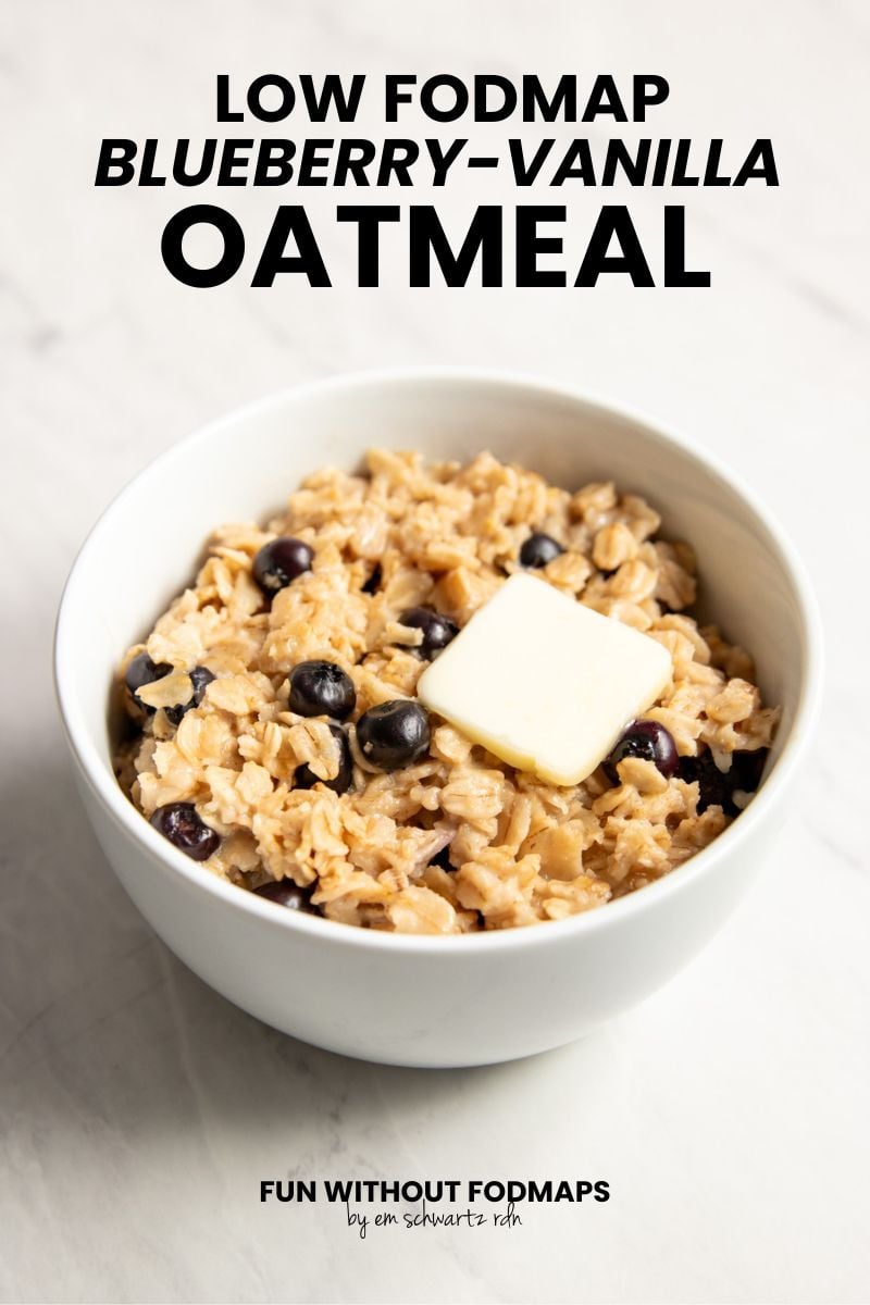 A bowl of oatmeal sitting on a white marble counter. In the white space above, black text reads Low FODMAP Blueberry-Vanilla Oatmeal