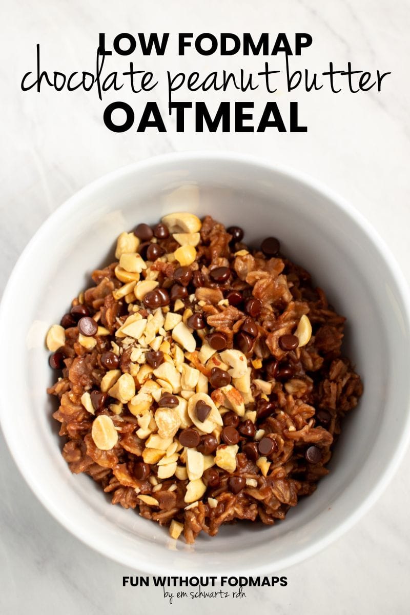 Looking down into a bowl of chocolatey oatmeal topped with peanuts and chocolate chips. In the white space above, black text reads "low FODMAP chocolate peanut butter oatmeal."